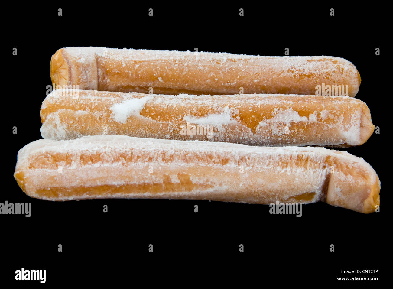 Picture of three frozen hot dogs on black Stock Photo Alamy