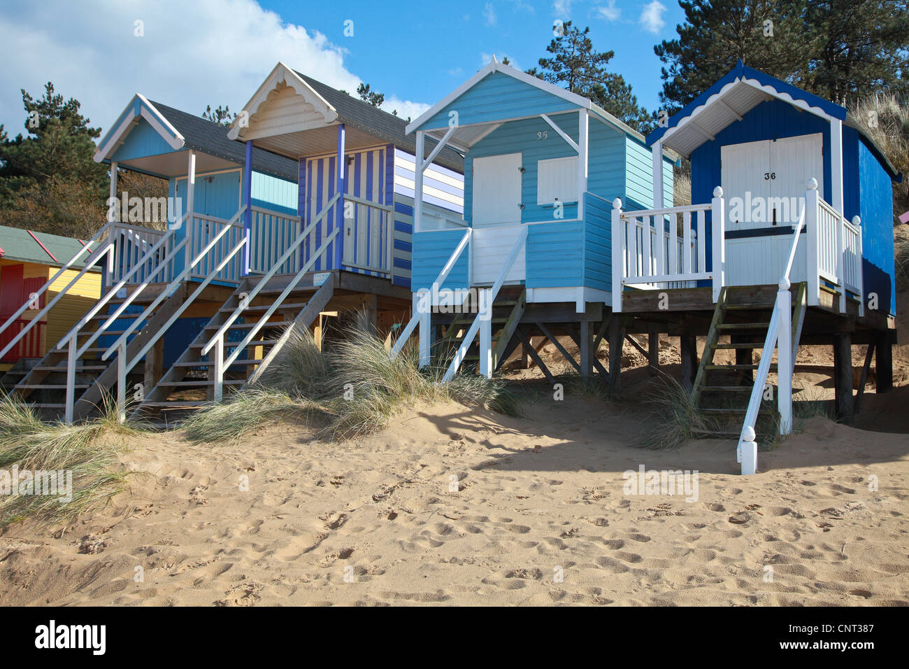 Beach huts, sand, holiday, summer, sun, in the UK, vacation, sea side, huts Stock Photo