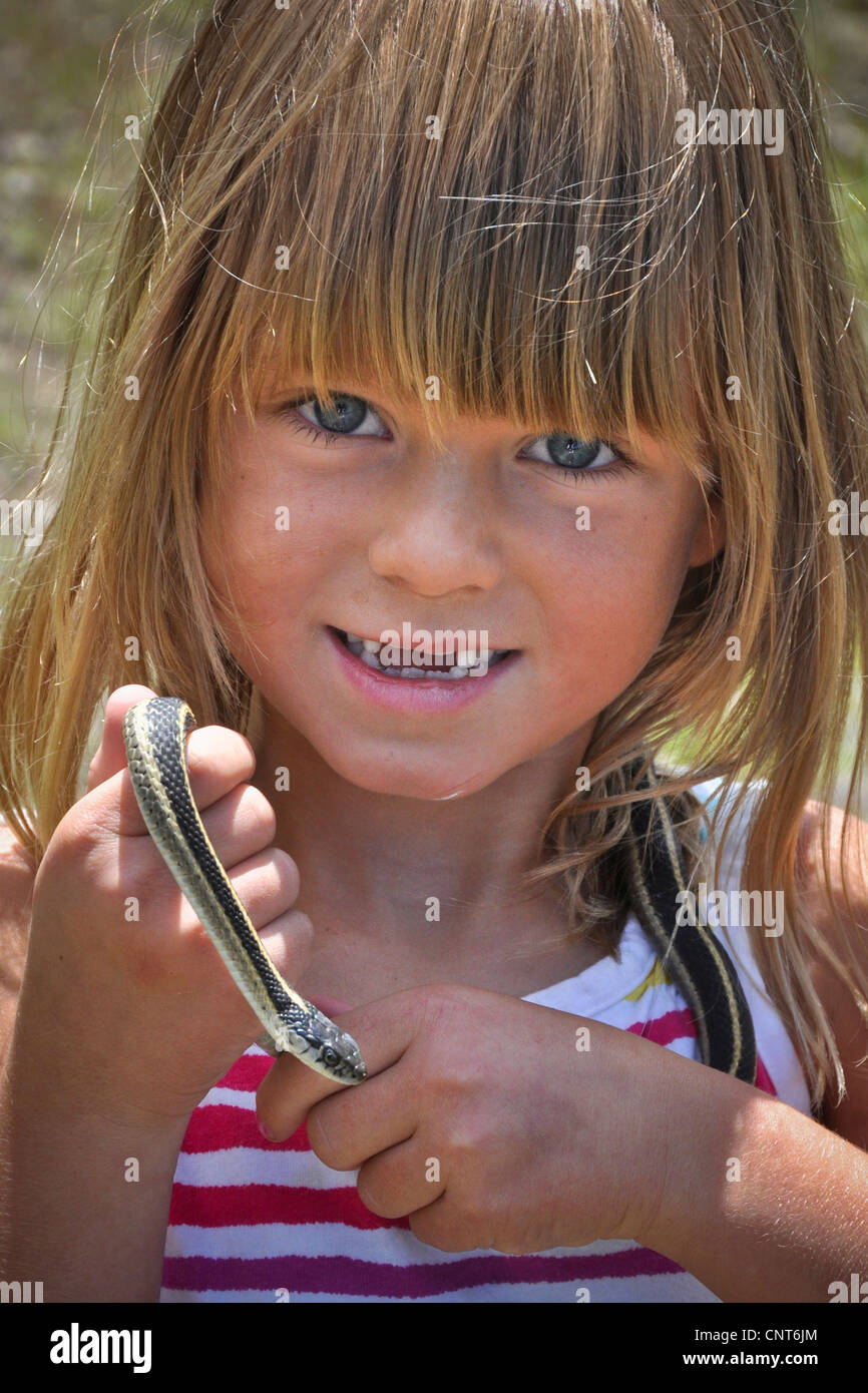 young girl garter snake smile happy wildlife reptile animal youth female Stock Photo