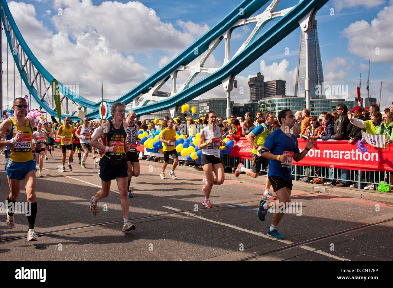 Runners in the London Marathon crossing Tower Bridge Stock Photo