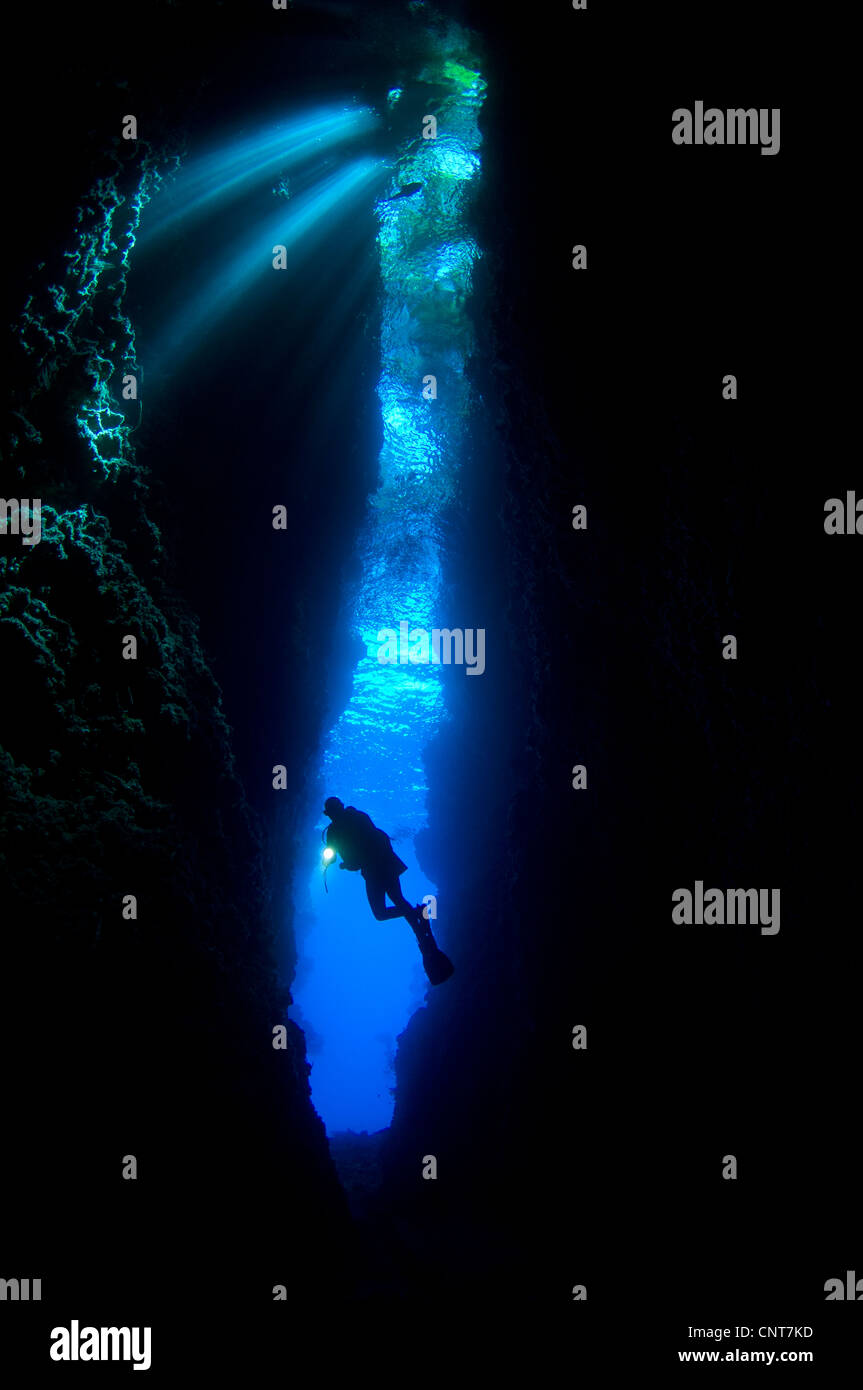 A diver explores the amazing underwater cavern known as Lerus Cut, Russell Islands, Solomons. Stock Photo