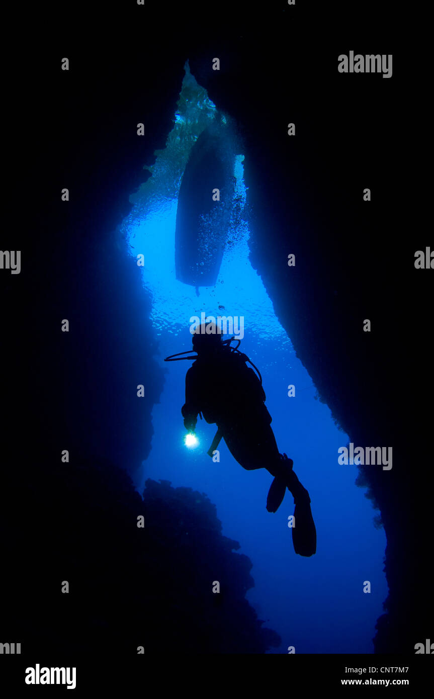 A diver explores the underwater cavern known as the Bat Cave, Russell Islands, Solomons. Stock Photo