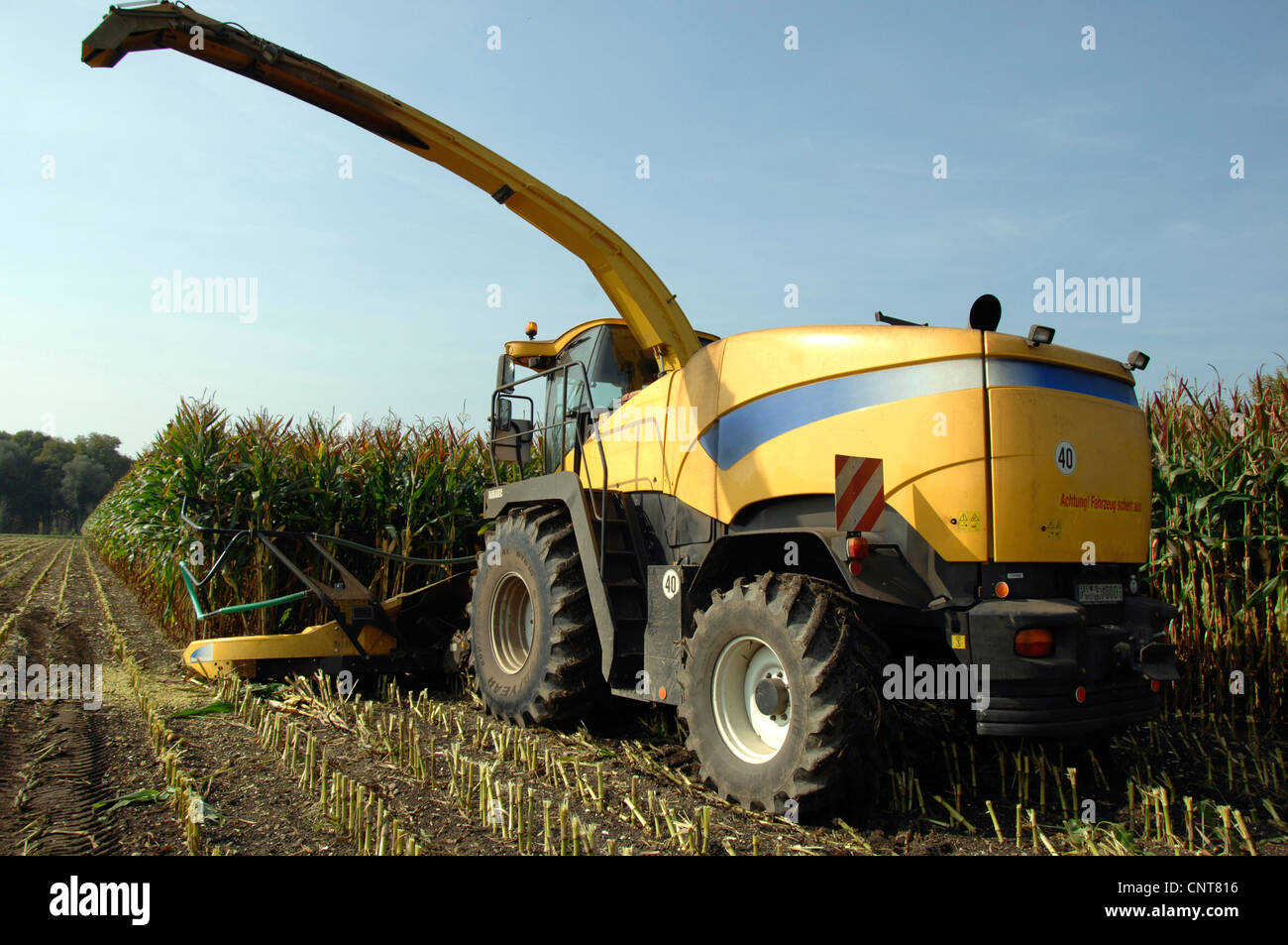 Tractor harvesting corn hi-res stock photography and images - Alamy