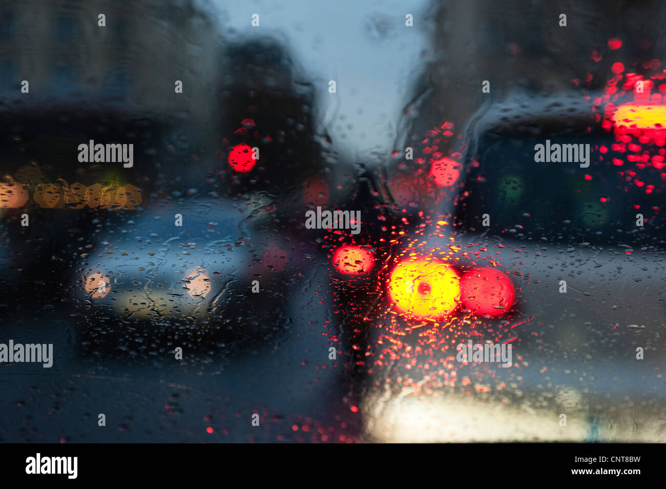 City traffic viewed through window during rain Stock Photo Alamy