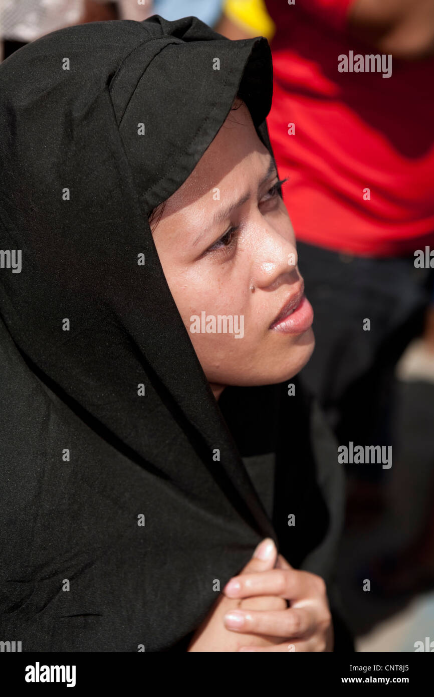 Cebu City, Philippines, Good-Friday, 6.April 2012: Actress playing Mother Mary as Gilbert Bargayo is being nailed to the cross.. Stock Photo