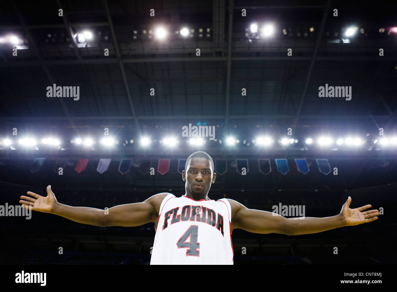 Basketball player with arms out, portrait Stock Photo Alamy