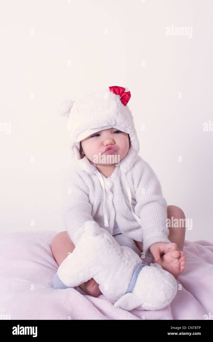 Baby girl pursing lips, portrait Stock Photo