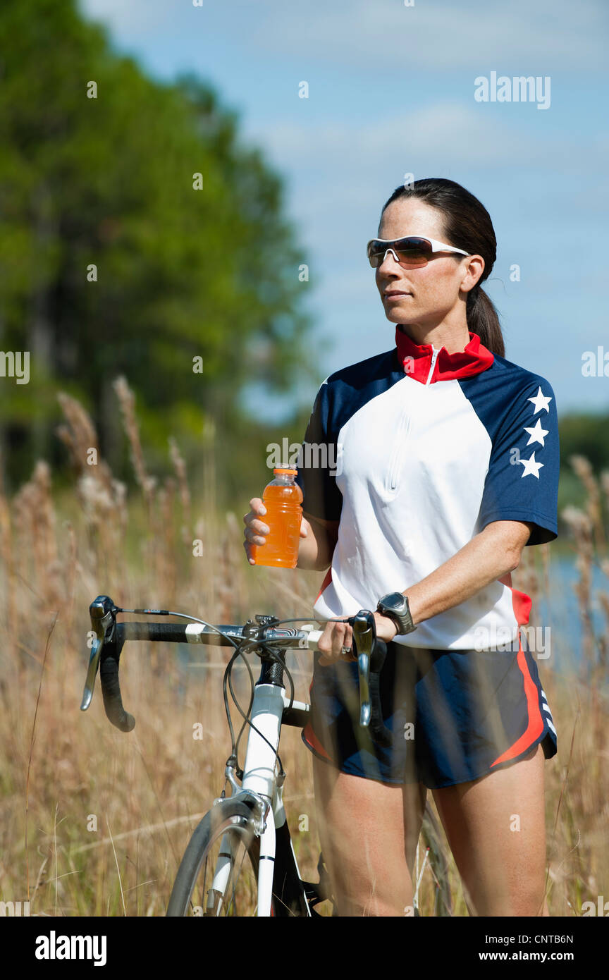Female cyclist taking break Stock Photo Alamy