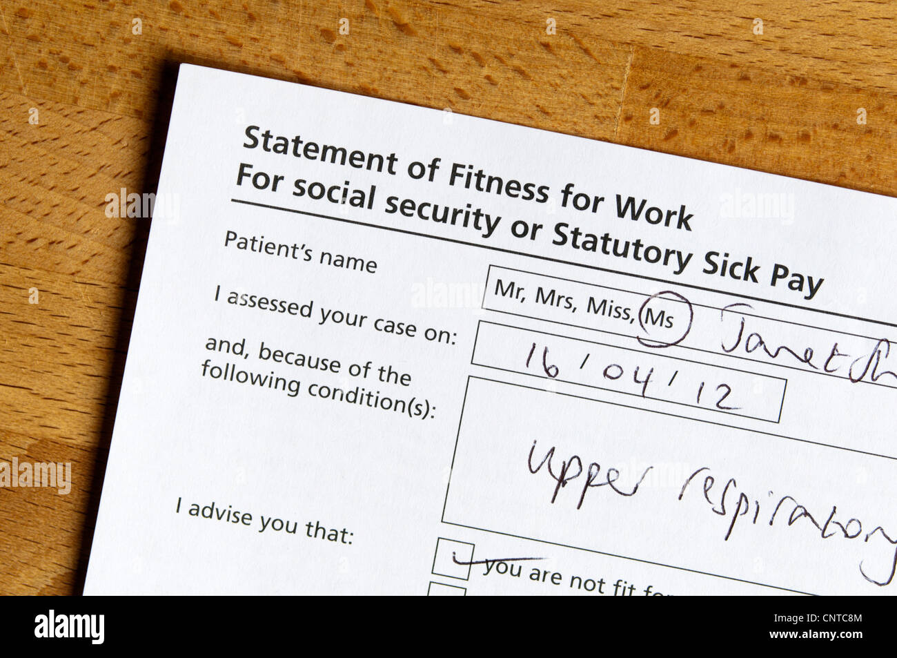 A Doctor's certificate signing someone off work. Stock Photo