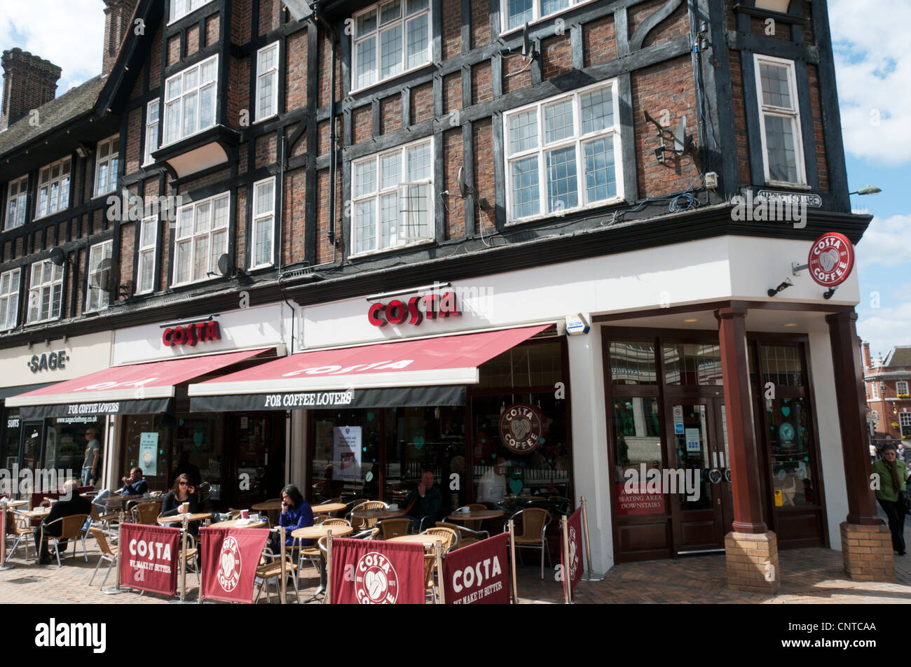 People Sitting At Tables Drinking Coffee Outside Costa Coffee In people-sitting-at-tables-drinking-coffee-outside-costa-coffee-in