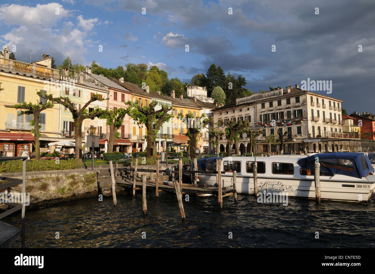 pier with a boats village of Orta San Giulio, Italy Stock Photo