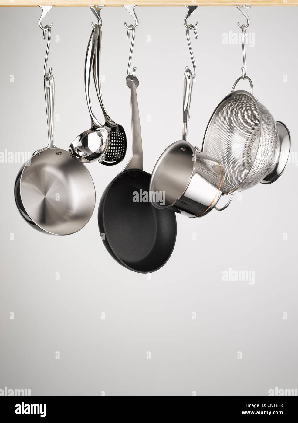 Pots and pans hanging from hooks Stock Photo Alamy