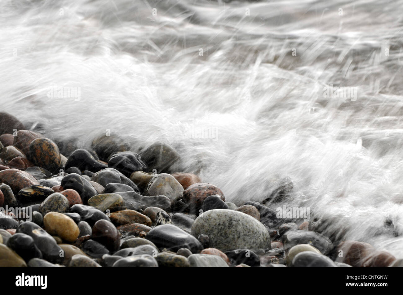 Baltic Sea surf on pebble beach, Germany, Mecklenburg Vorpommern Stock Photo