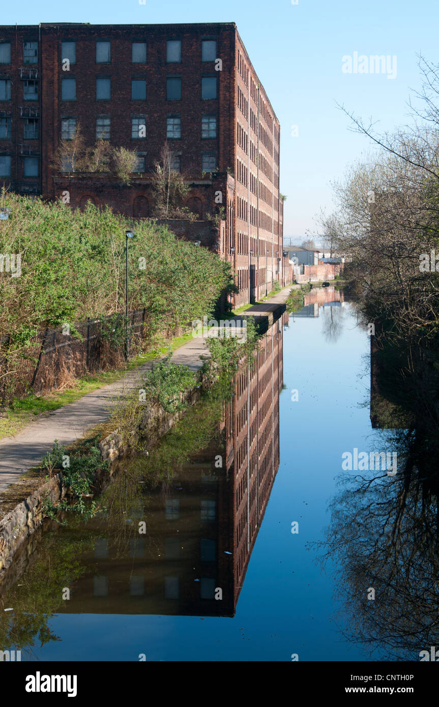 Former cotton mill by the Ashton Canal, Beswick, Manchester, England, UK Stock Photo