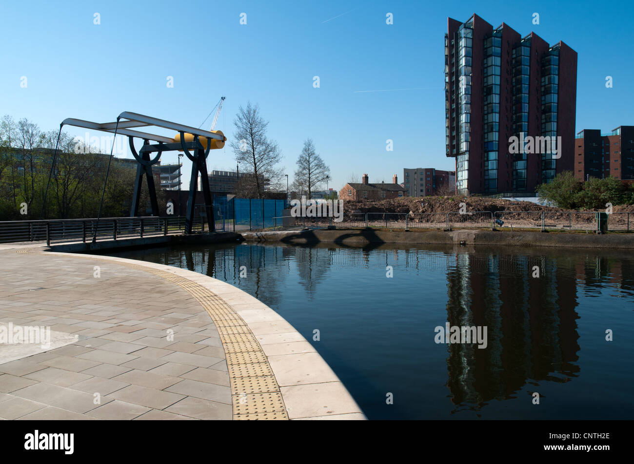Islington Wharf apartment block and bascule lifting bridge, New Islington, Ancoats, Manchester, England, UK Stock Photo