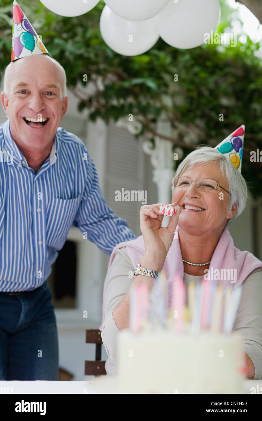 Older couple laughing at birthday party Stock Photo - Alamy