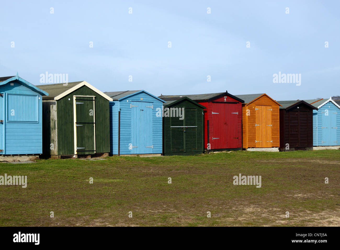 BEACH HUTS IN WINTER AT DOVERCOURT ON THE ESSEX COAST. UK Stock Photo