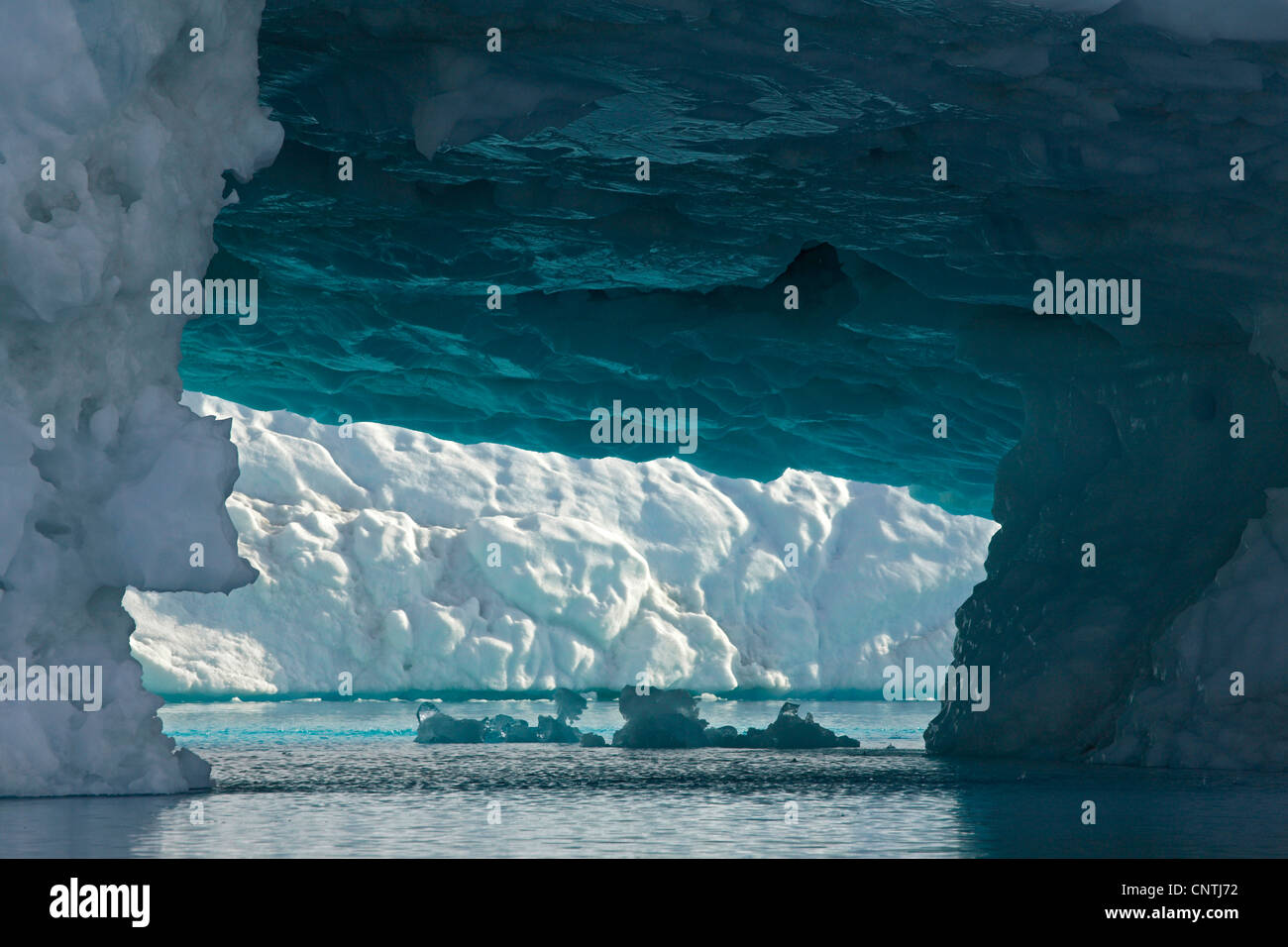 iceberg and icecave at Sermilik Fjord, Greenland, Ammassalik, East Greenland, Tiniteqilaq Stock Photo