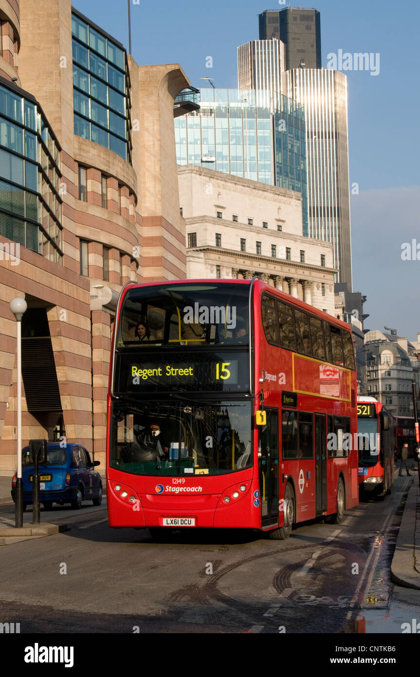 An Alexander Dennis Enviro 400 bus operated by Stagecoach London passes along Queen Victoria Street in the city of London Stock Photo