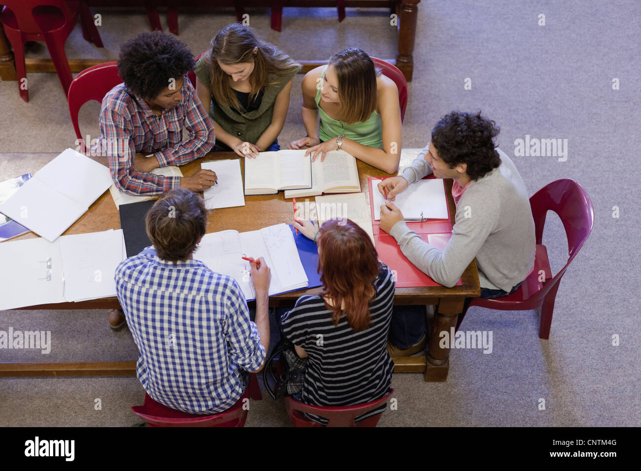 Students studying together in library Stock Photo