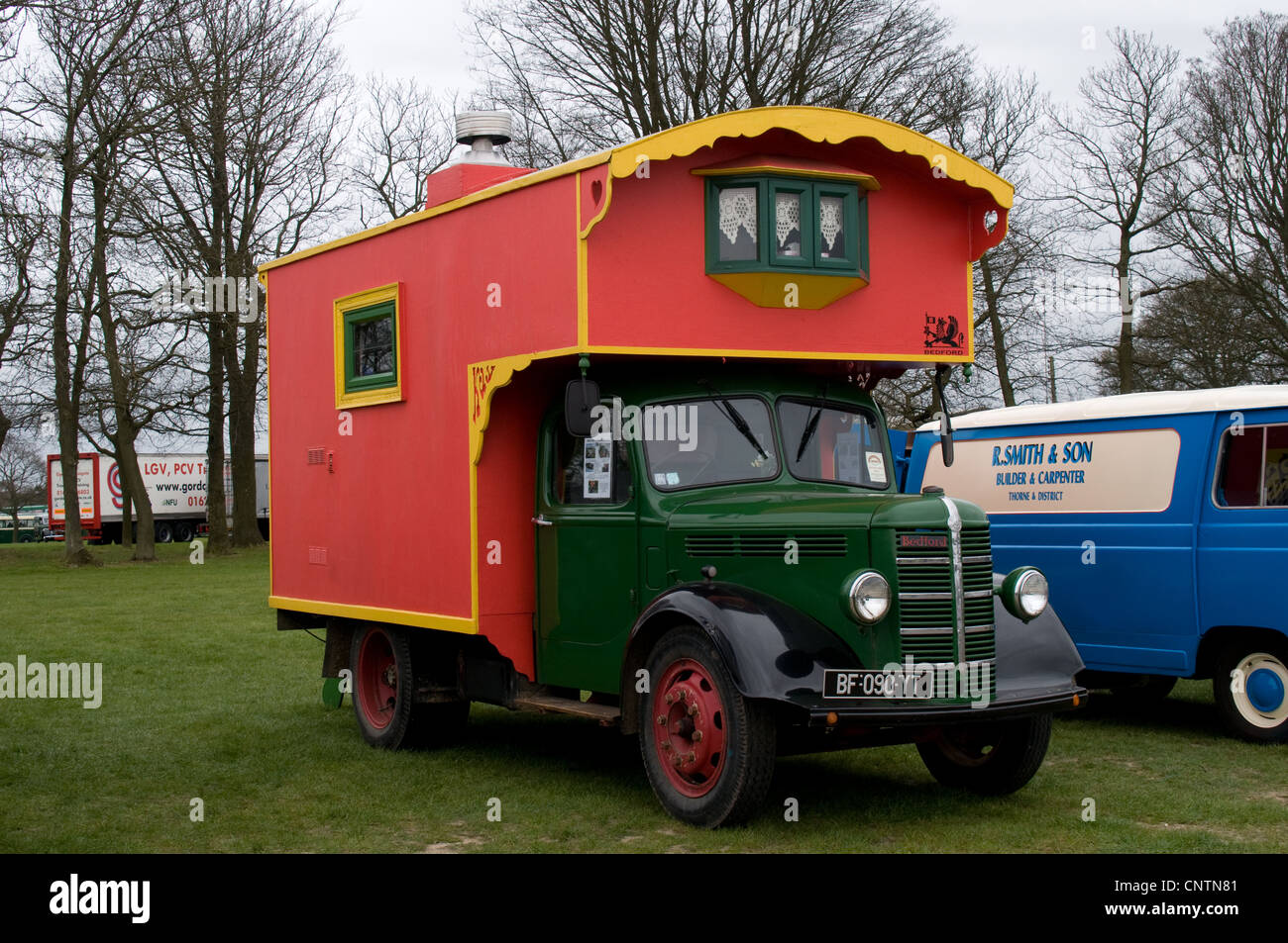 A French registered Bedford O type lorry with an ornate mobile home on ...