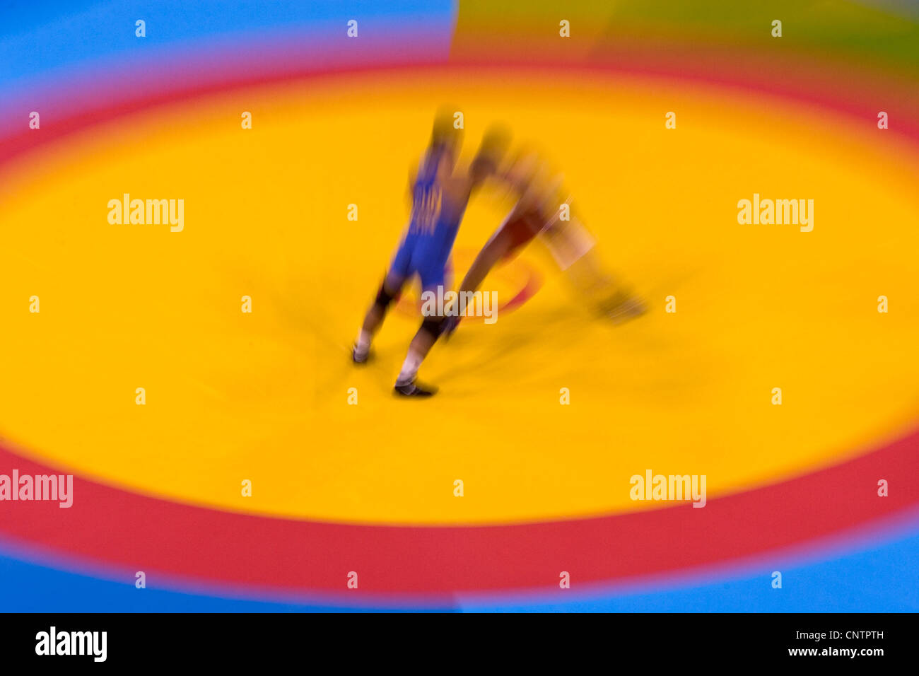Zoom blur image of Greco Roman wrestlers in action. Stock Photo