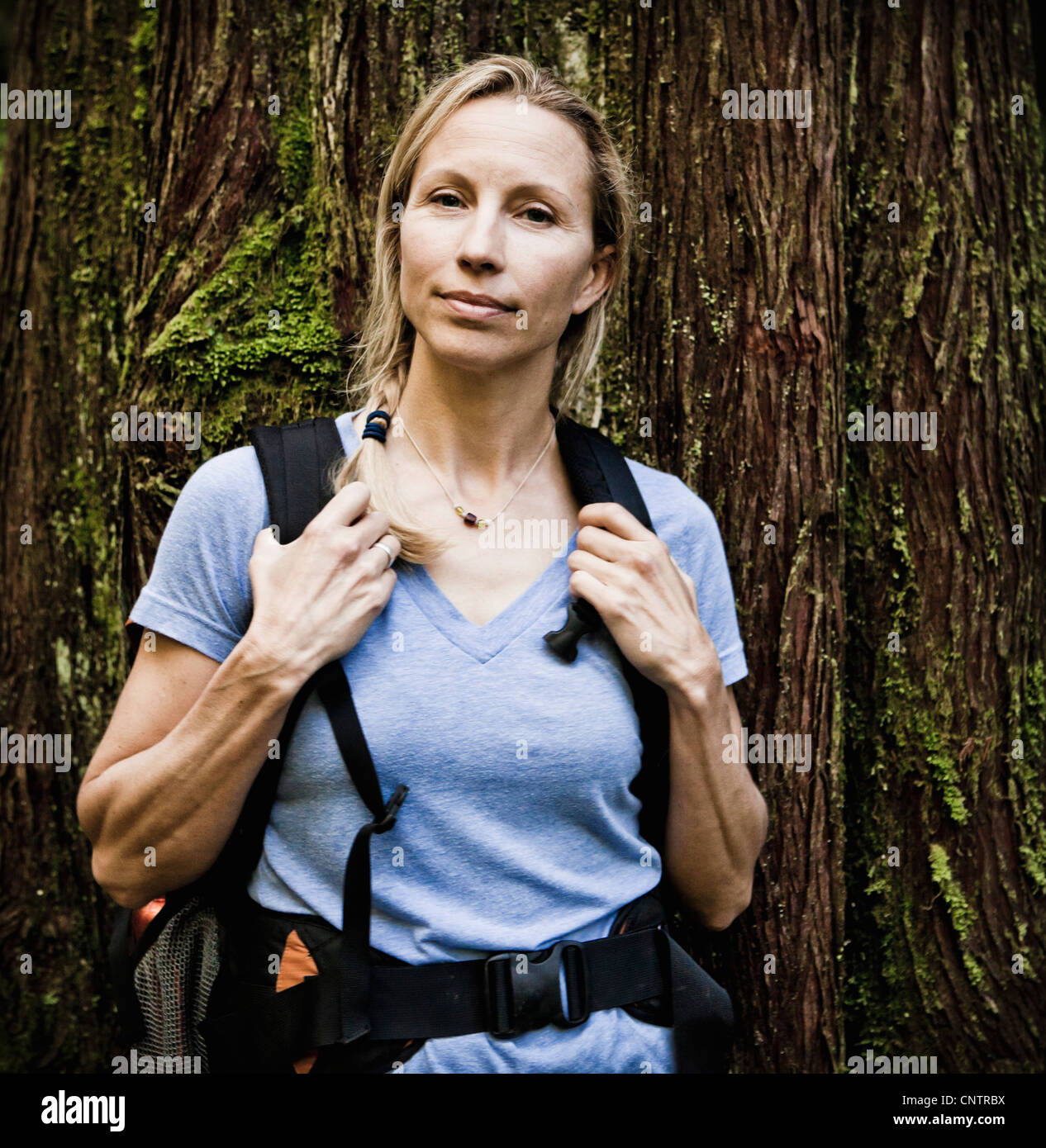 Portrait of a middle aged Caucasian woman wearing a backpack, Little Si trail, Washington, USA. Stock Photo