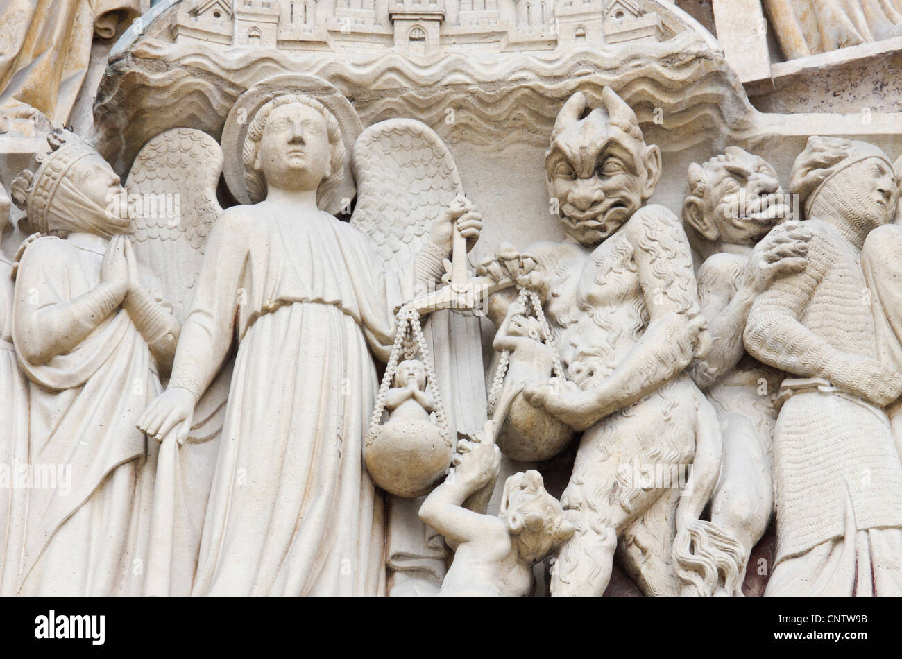 Statues depicting the judgment of souls, exterior of Notre Dame cathedral,  Paris, France Stock Photo - Alamy