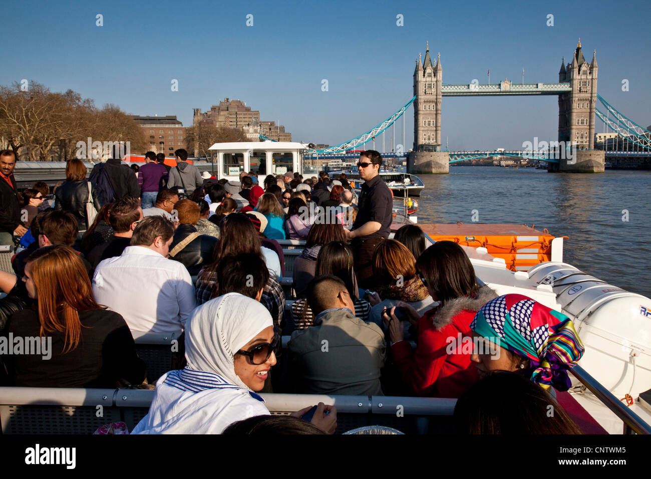 Tourists on a City Cruise Boat, River Thames, London, England Stock Photo