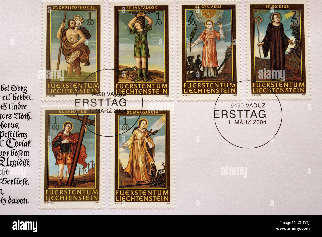 Commemorative postage stamps issues on first day cover from Liechtenstein. This issue commemorates various saints 2004, stamp collecting hobby Stock Photo