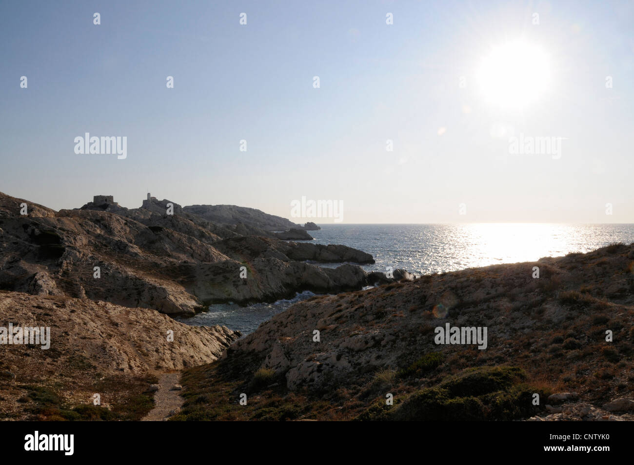 The late afternoon sun setting over the rocky coastline on the Ile de Pomegues near Marseille,France Stock Photo