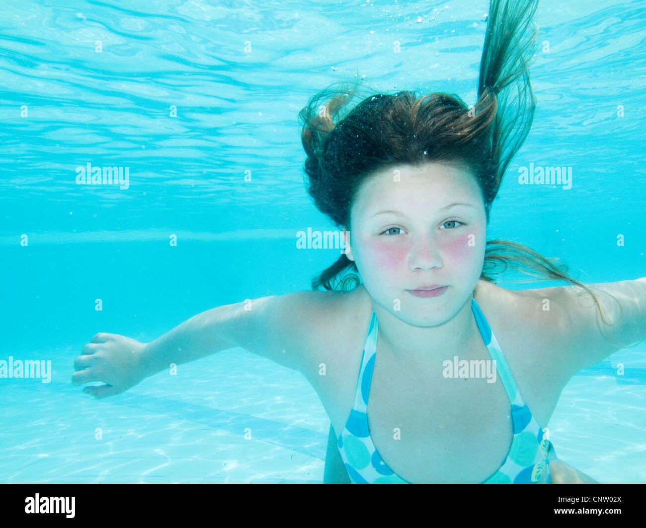 Teenage girl swimming in tropical ocean Stock Photo, Royalty Free Image ...