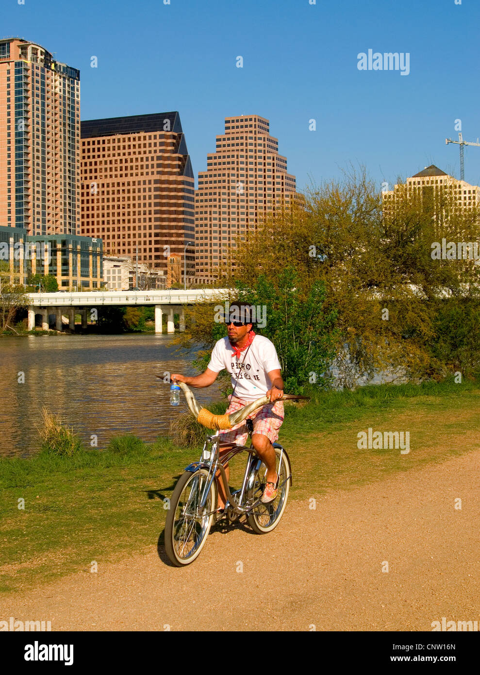 Lady Bird Lake's trail network is popular with bikers. Stock Photo
