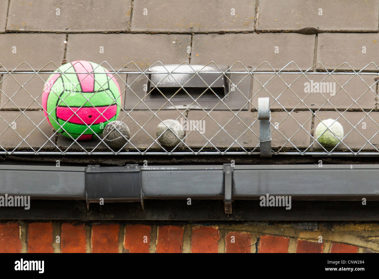 Tennis football chickenwire gutter guttering hires stock photography