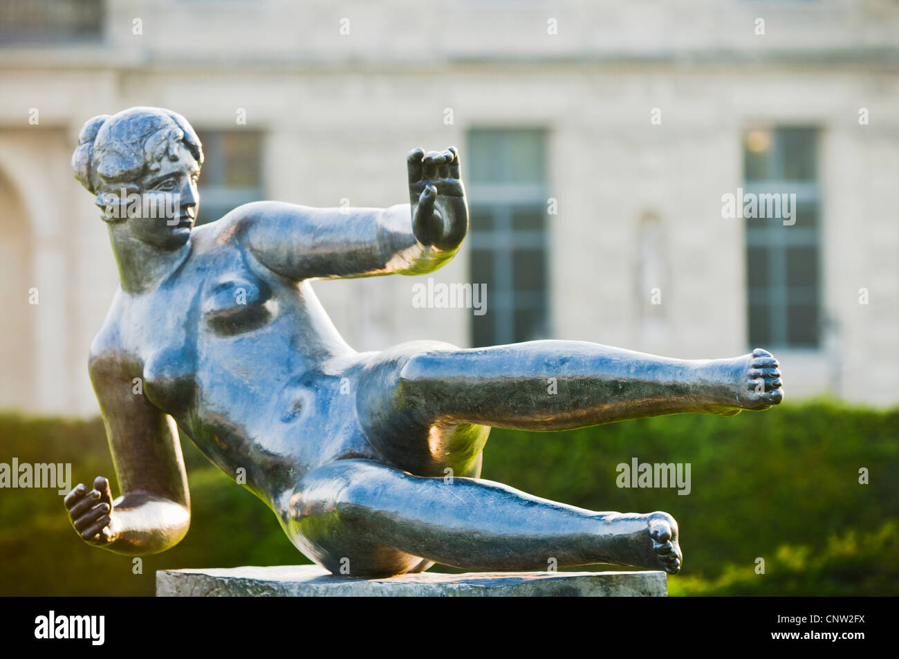 Air statue by Aristide Maillol in Jardin du Carroussel with the Louvre Museum in the background. Paris, France. Stock Photo