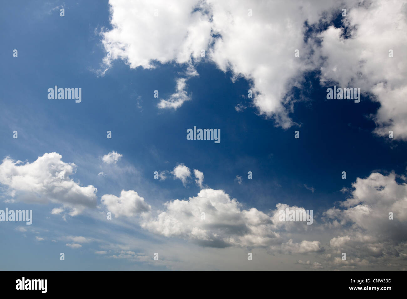 Deep blue sky with sunlight and clouds Stock Photo