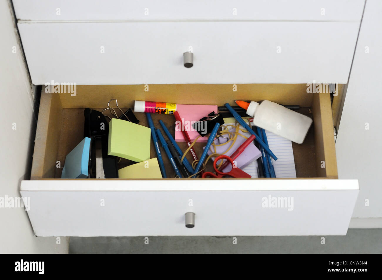 A before and after view of a clean and messy drawer. Stock Photo