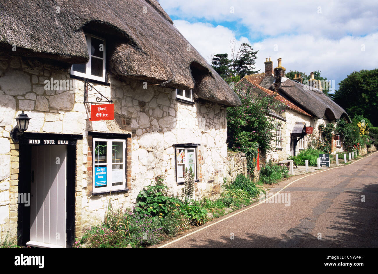 United Kingdom, Great Britain, England, Hampshire, Isle of Wight, Thatched Cottages in Brighstone Village Stock Photo