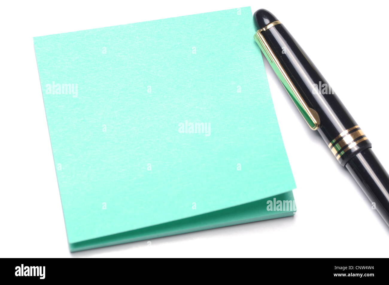 Light green adhesive note and pen Stock Photo