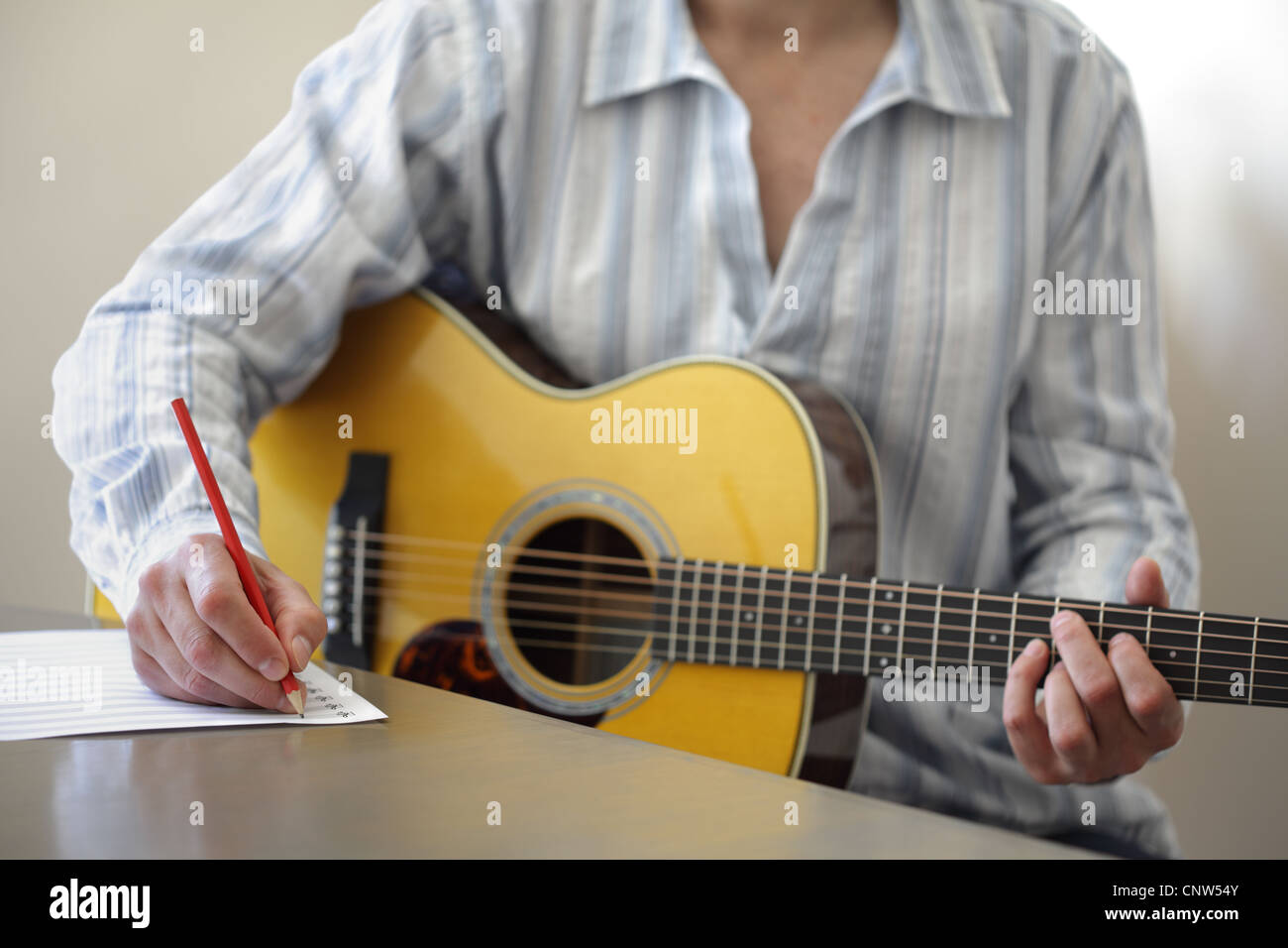 Song writing with acoustic guitar Stock Photo Alamy