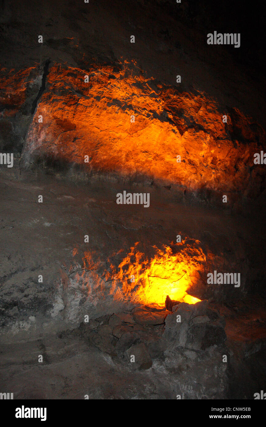 tunnel in volcanic rock illuminated by glowing lava, Canary Islands, Lanzarote Stock Photo