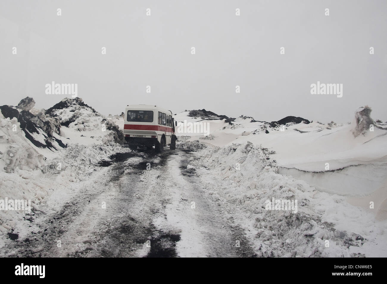 bus with torurist on a snocovered top of Mount Etna, Italy, Sicilia Stock Photo