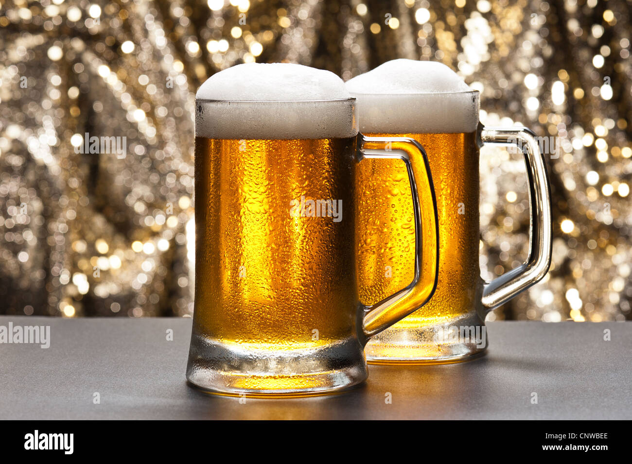 Beer mug in front of a glittering background with a cool beer Stock Photo -  Alamy