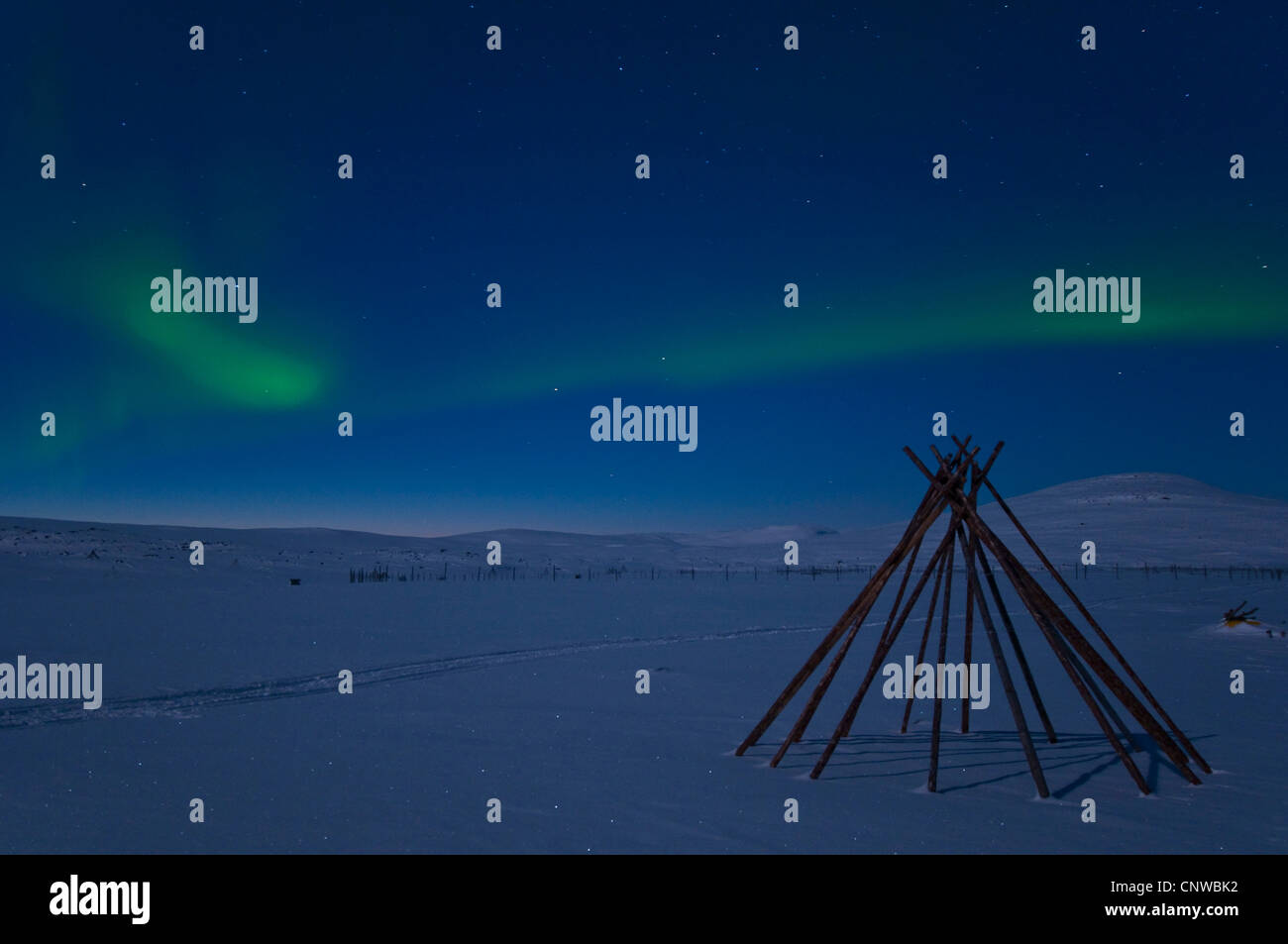 frame of a Sami tent in polar lights (Aurora borealis), Sweden, Lapland, Norrbotten, Padjelanta National Park Stock Photo