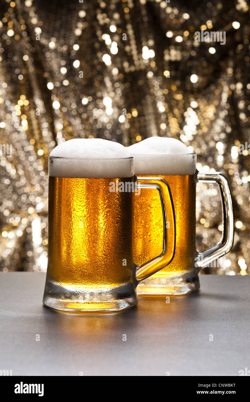 Beer mug in front of a glittering background with a cool beer Stock Photo -  Alamy