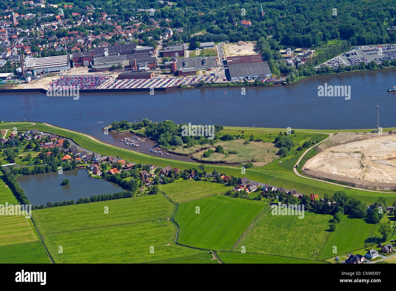 aerial view to Lemwerder. Bremen Blumenthal with car terminal and Bremer Woll-Kaemmerei in background , Germany, Lower Saxony, Wesermarsch, Lemwerder Stock Photo