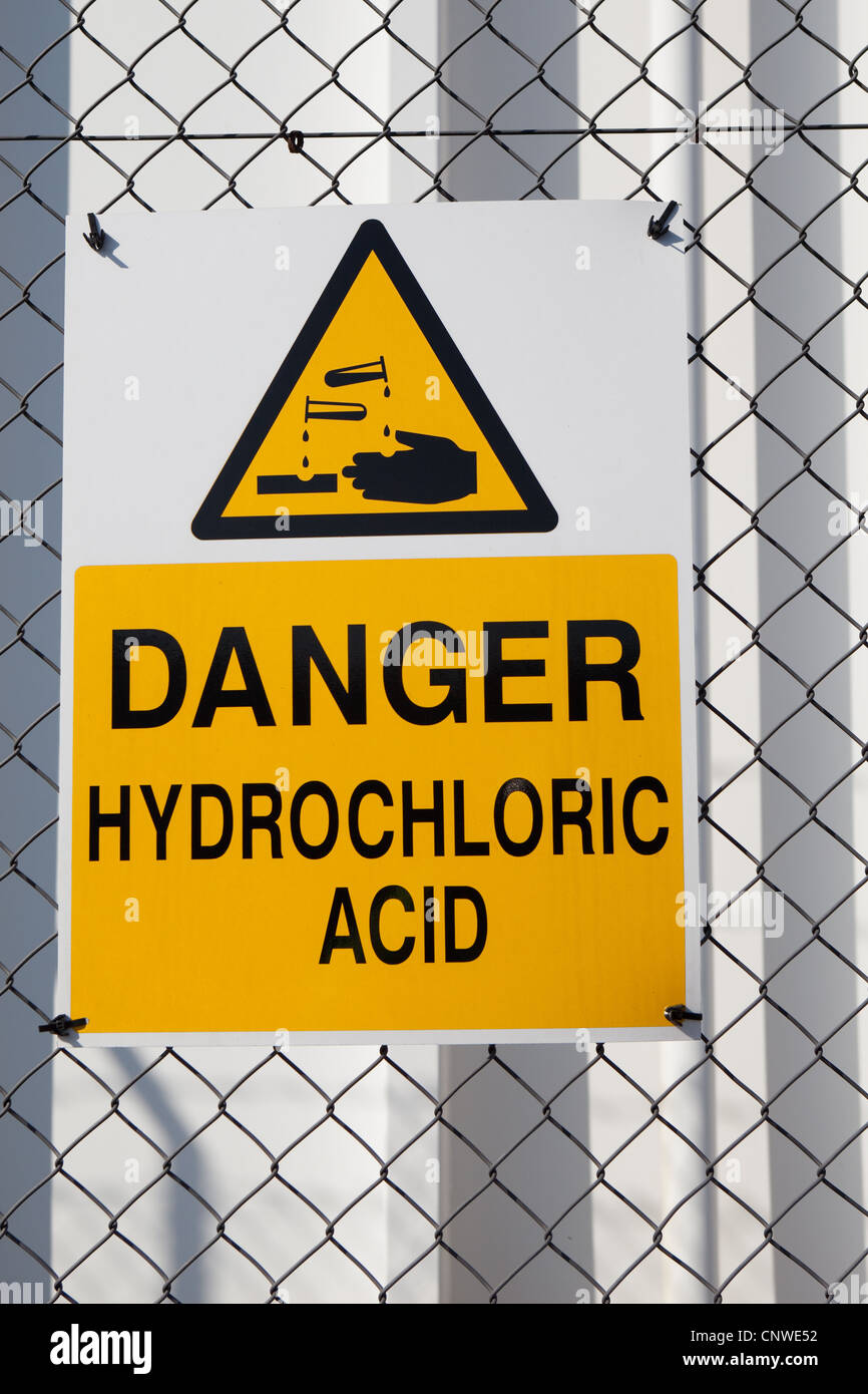 Warning triangle corrosive Hazard sign Danger Hydrochloric Acid sign Stock Photo