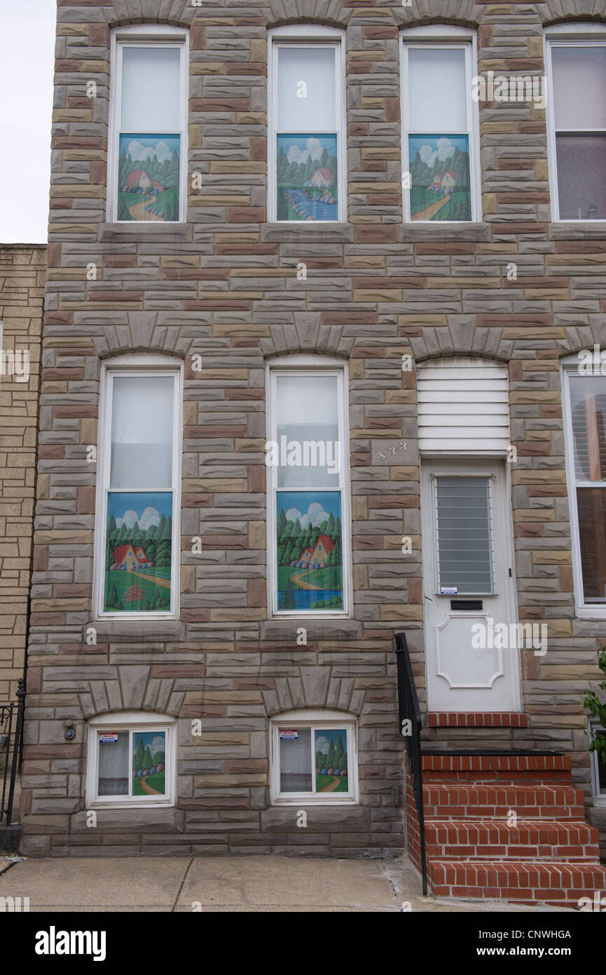 Painted Screens of Baltimore in the windows of city rowhouses Stock