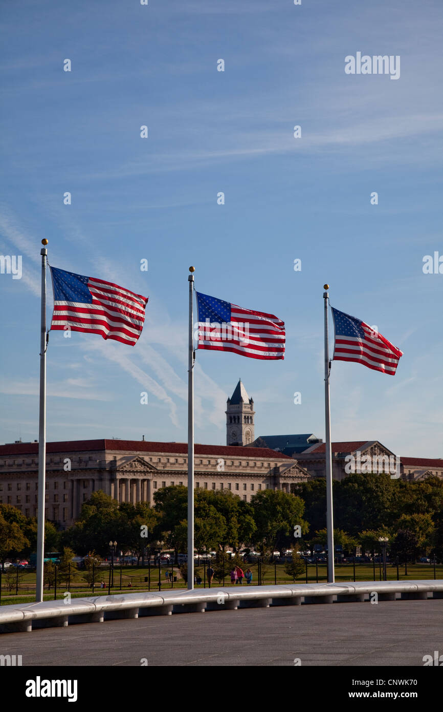 The stars and stripes flying at the base of the Washington Monument Stock Photo