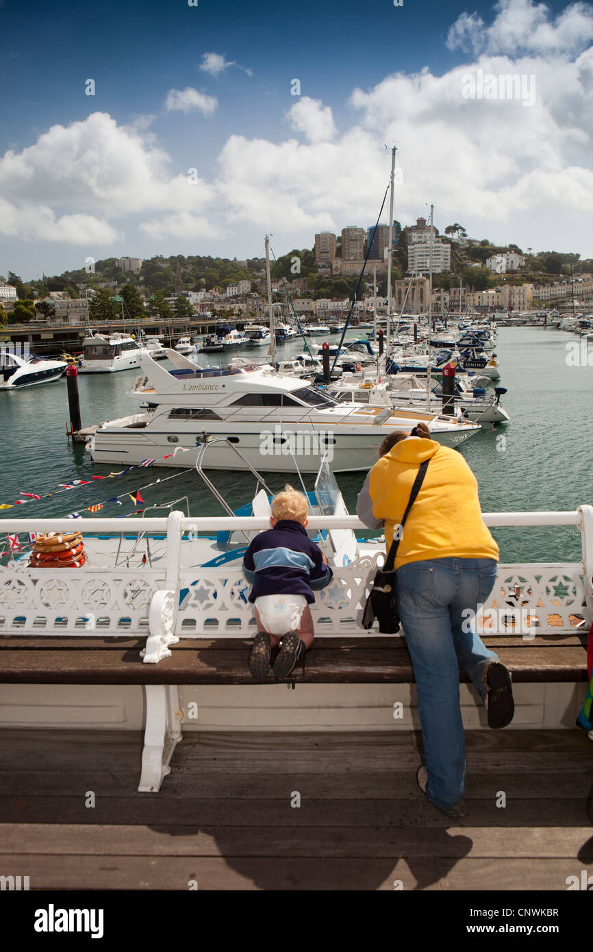 UK, England, Devon, Torquay harbour, mother and young child looking at boats Stock Photo